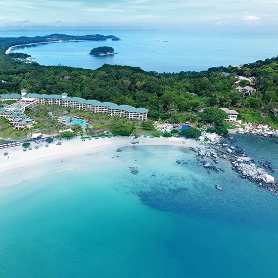An aerial view of a beach and some buildings