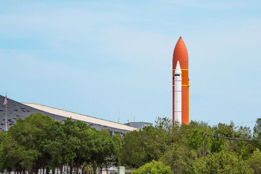 A rocket is shown on top of the ground.