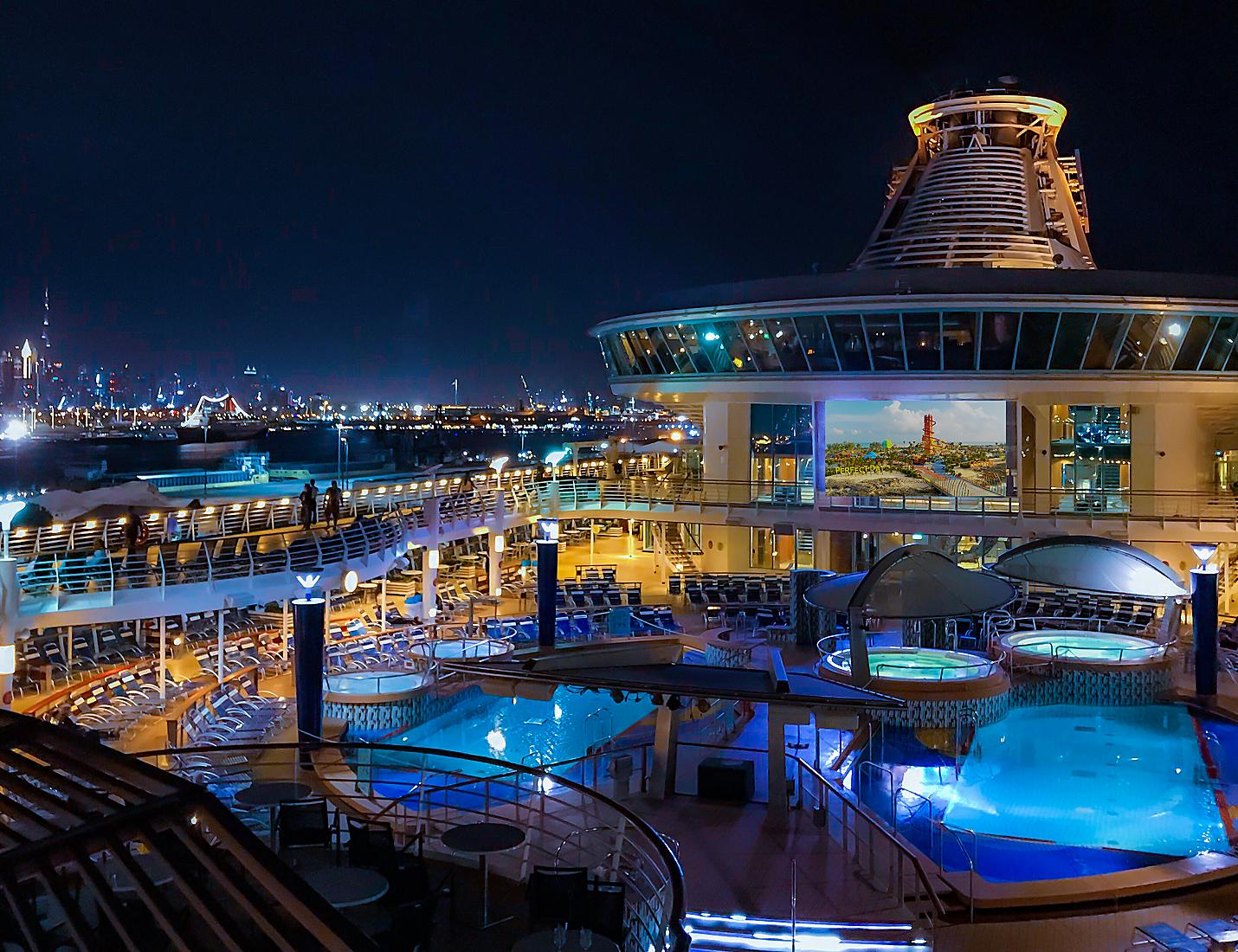 A large pool with lights on the side of it.