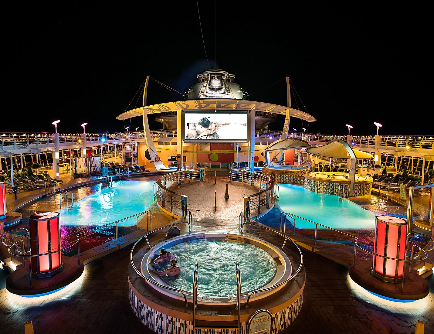 A pool with a large screen in the middle of it